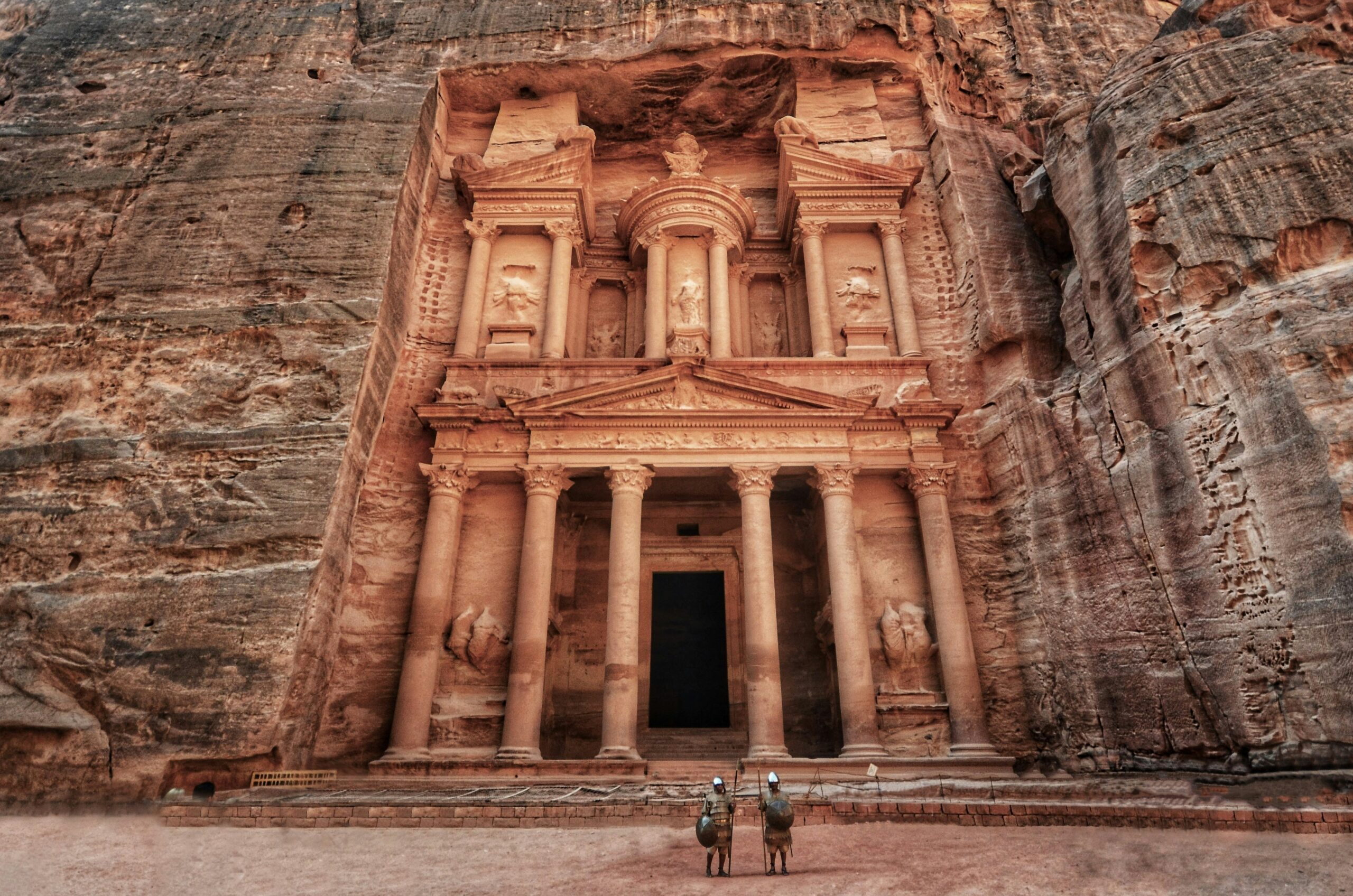 The ancient hand-carved stone facade of the Treasury building in Petra Jordan