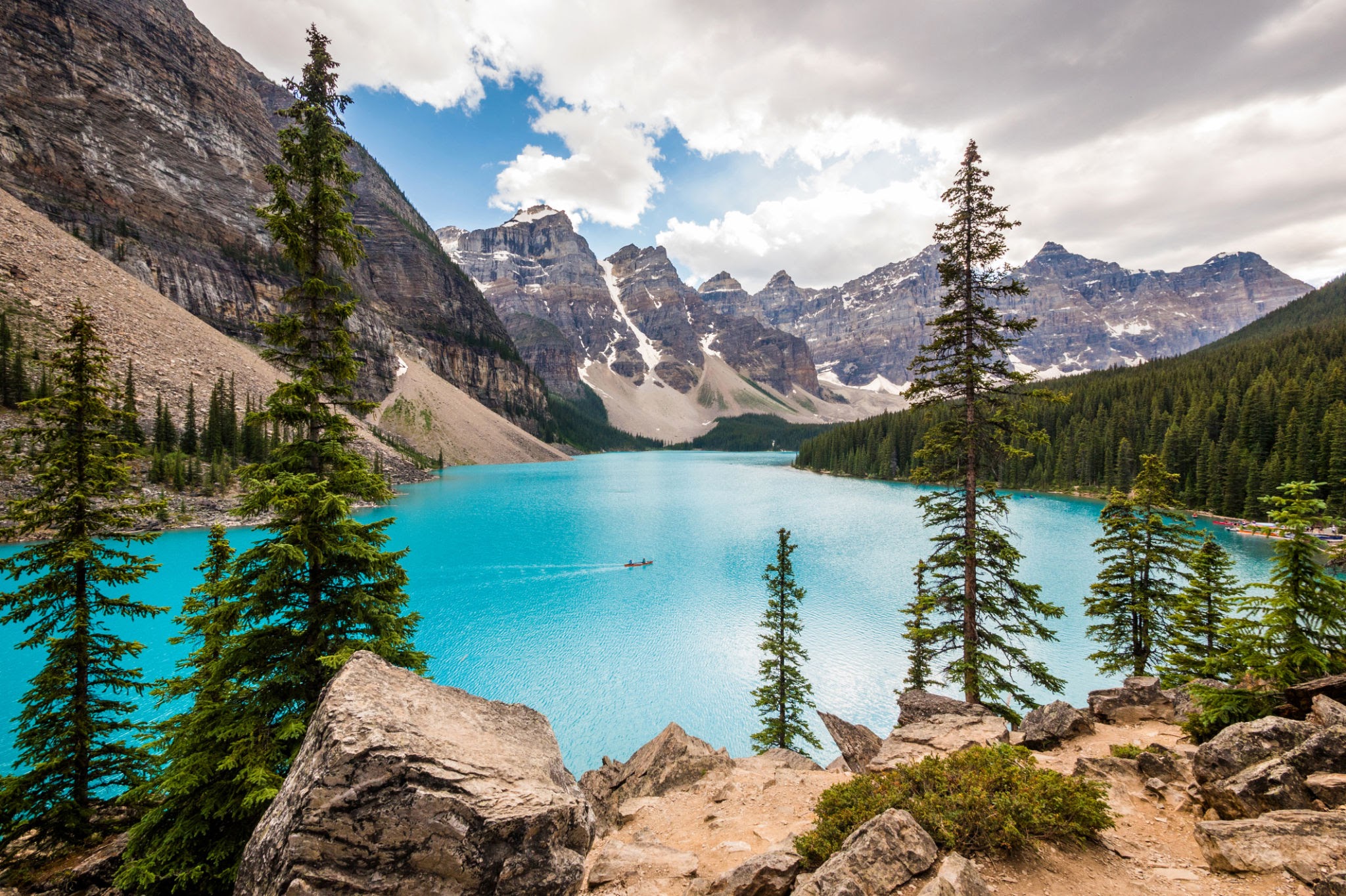 Turquoise waters of Moraine Lake surrounded by the rocky mountains of Banff National Park Canada